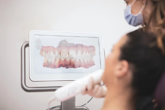 Dental scanner capturing digital impressions of teeth.