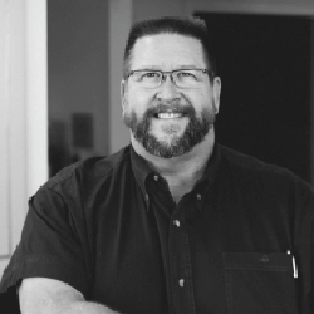 Headshot of John H. Paul, DMD, smiling confidently.