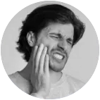 Illustration of a tooth with pain indicators and a distressed expression.